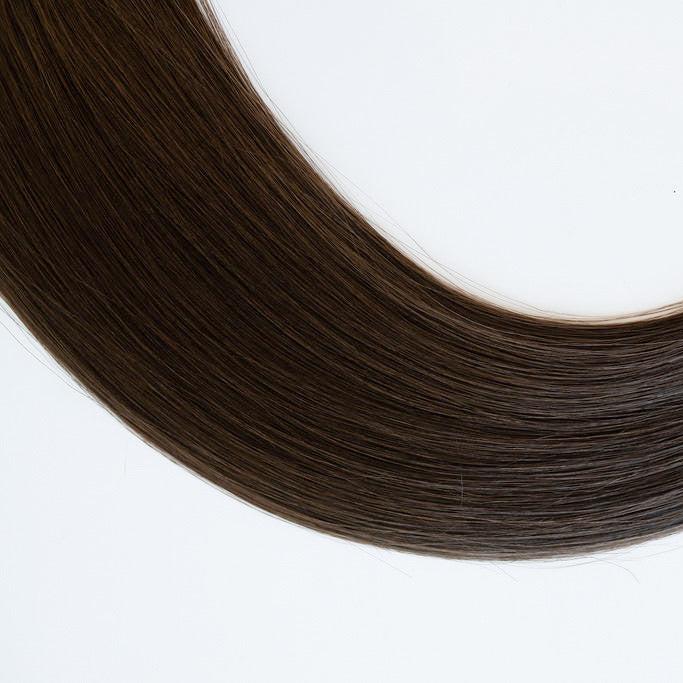 Anna color Siren Hair Extensions featuring a neutral Level 6 brunette shade, showcasing premium Remy Human Hair with a natural, root-to-end even tone. Ideal for creating darker brunette styles.