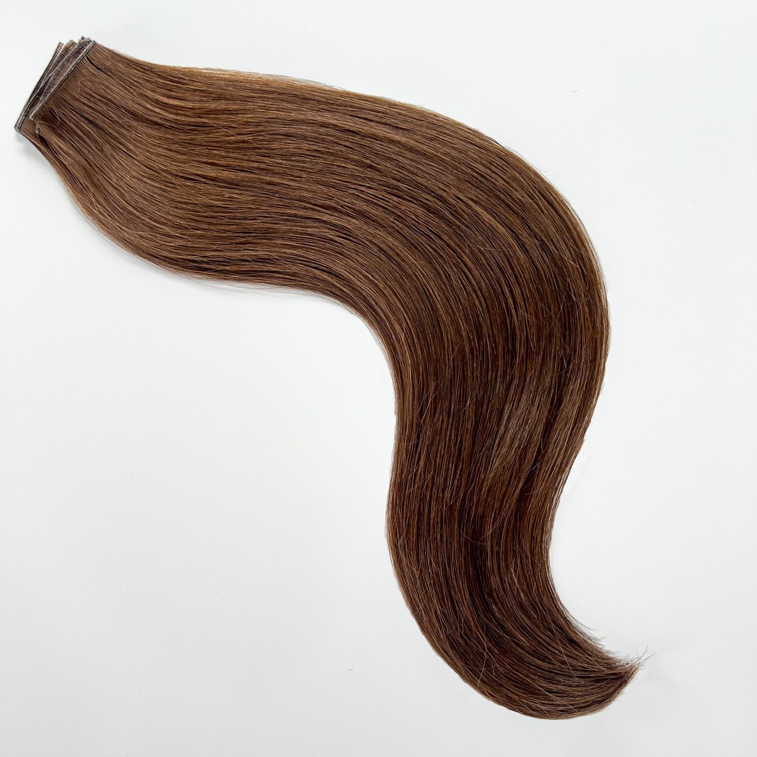 Anna color Siren Hair Extensions featuring a neutral Level 6 brunette shade, showcasing premium Remy Human Hair with a natural, root-to-end even tone. Ideal for creating darker brunette styles.