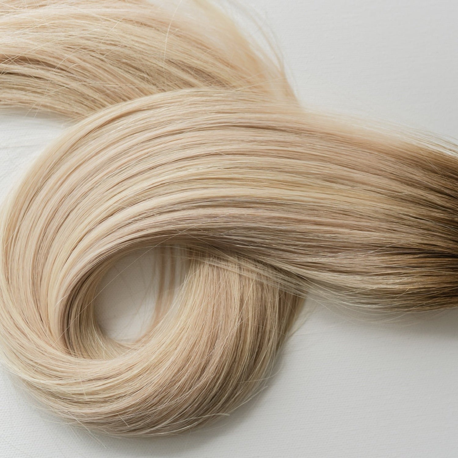 Anne color Siren Hair Extensions featuring a neutral Level 8 base with piano-keyed dimensional blonde ends, including Level 10 neutral and cool/pearl highlights. Perfect for natural blonde styles.