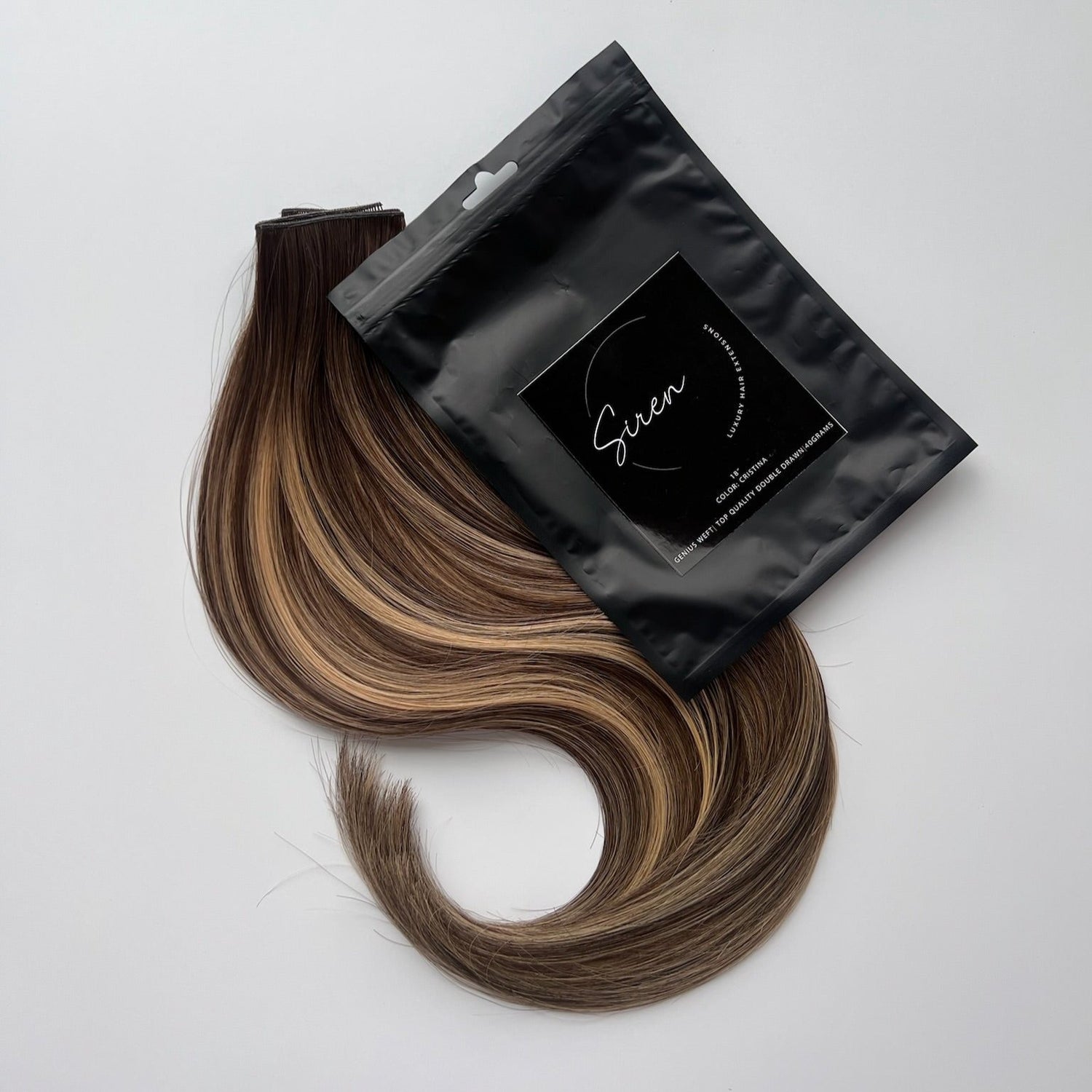 Cristina color Siren Hair Extensions featuring a neutral/warm Level 6 base with piano-keyed dimensional ends, including Level 6 lowlights and Level 10 sunny golden blonde highlights. Perfect for darker &