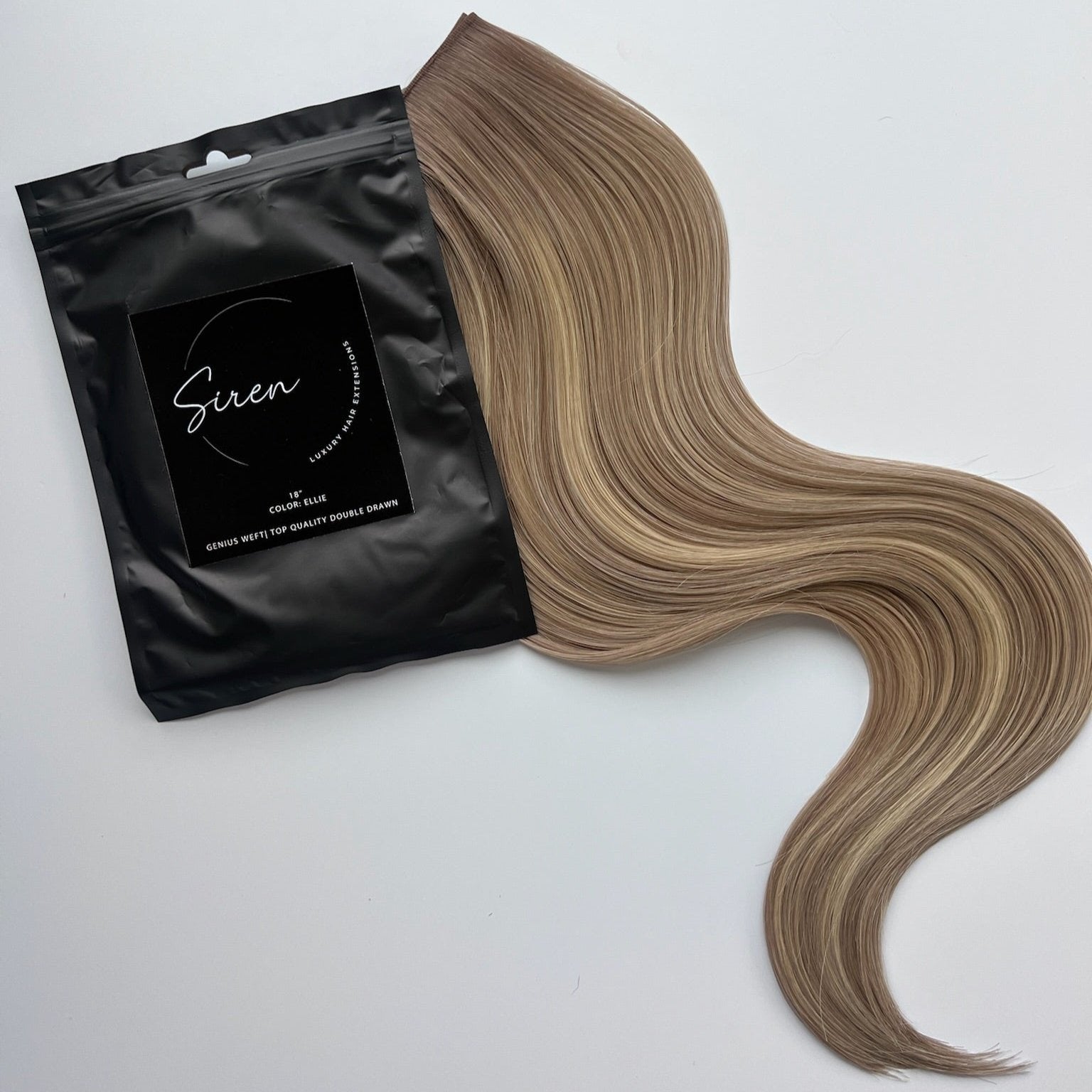 Ellie color Siren Hair Extensions featuring a neutral/cool Level 9 base with piano-keyed dimensional ends, including Level 9 cool/pearl lowlights and Level 10 neutral blonde highlights. Ideal for natural blondes seeking subtle dimension.