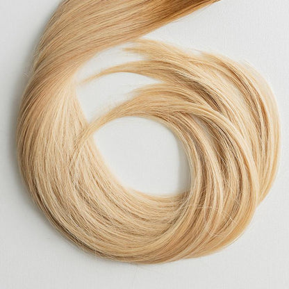 Heidi color Siren Hair Extensions featuring a golden copper Level 8 base with piano-keyed dimensional ends, including Level 9 golden copper lowlights and Level 10 sunny golden blonde highlights. Perfect for natural strawberry blonde and sunny blonde styles.