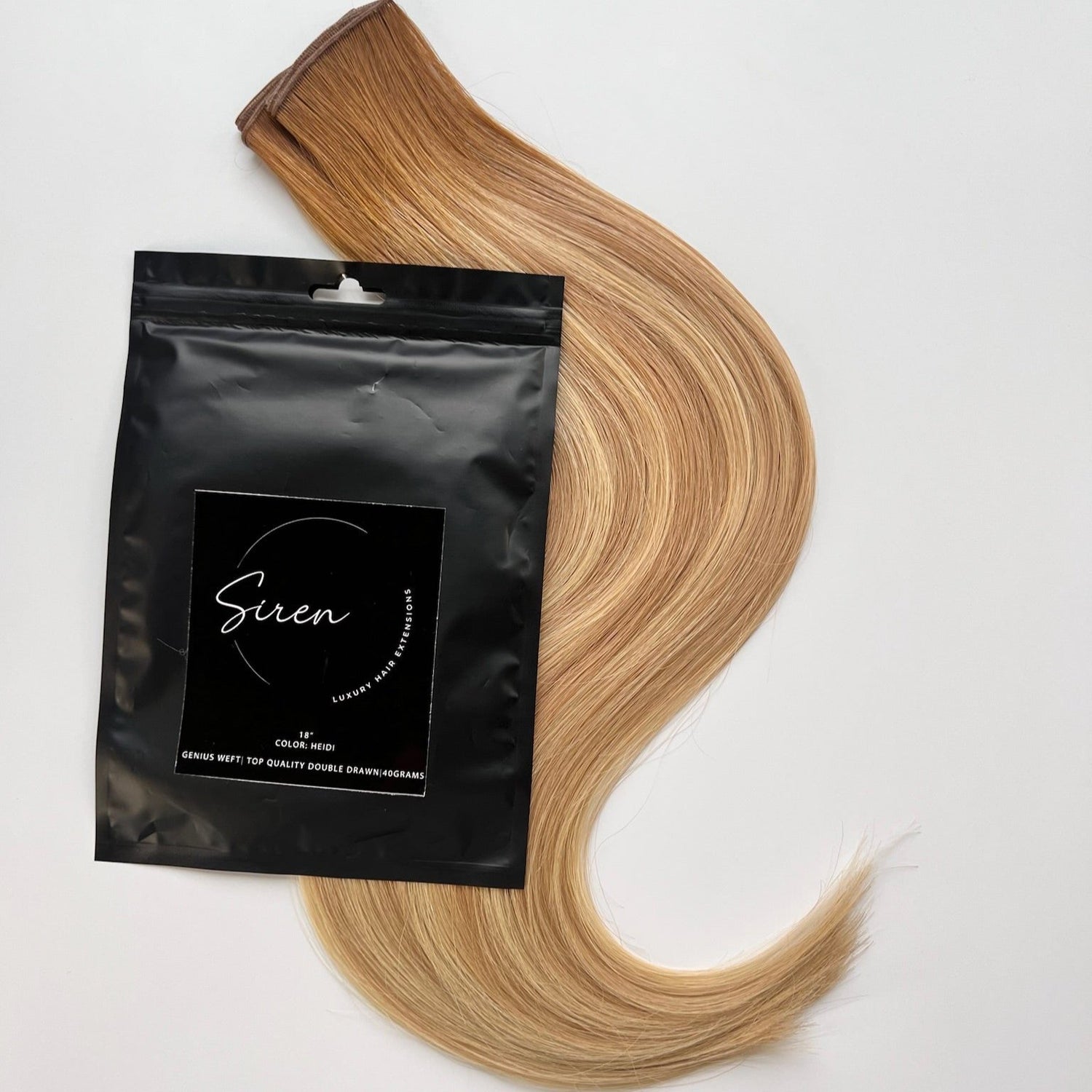 Heidi color Siren Hair Extensions featuring a golden copper Level 8 base with piano-keyed dimensional ends, including Level 9 golden copper lowlights and Level 10 sunny golden blonde highlights. Perfect for natural strawberry blonde and sunny blonde styles.