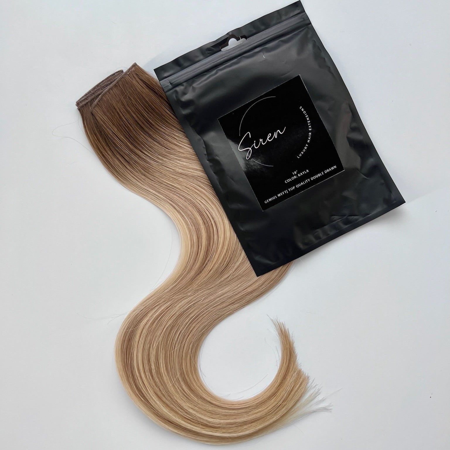 Kayla color Siren Hair Extensions featuring a warm Level 7 base with piano-keyed dimensional ends, including Level 9 sunny golden blonde lowlights and Level 10 sunny golden blonde highlights. Perfect for creating a lived-in sunny blonde look.