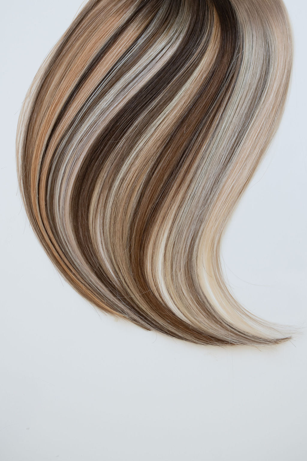 Hair swatch ring from Siren Luxury Hair Extensions showcasing a variety of blonde and brunette shades, highlighting the premium quality and natural texture of the Remy Human Hair extensions.