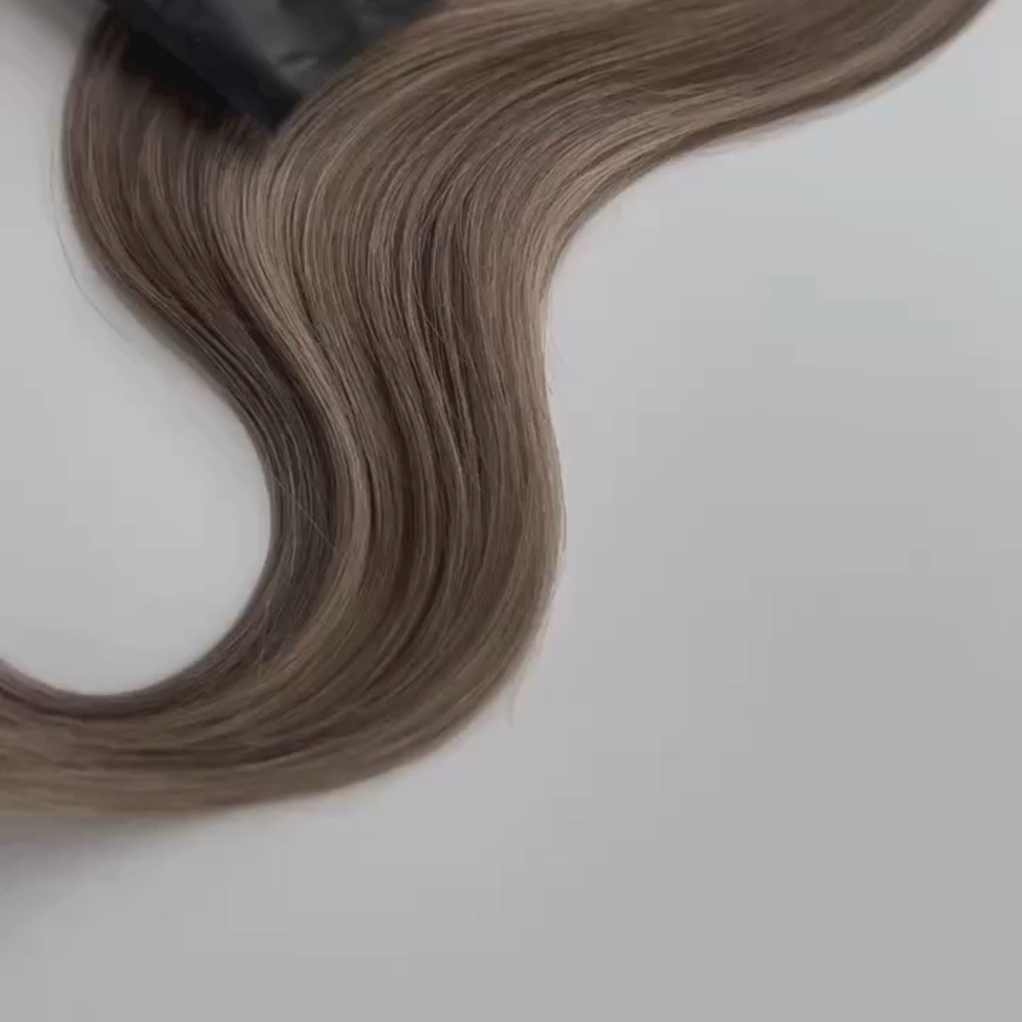 Kylee color Siren Hair Extensions featuring a neutral Level 7 base with piano-keyed dimensional ends, including neutral Level 7 lowlights and champagne blonde Level 9 highlights. Ideal for natural brunettes seeking a subtle bronde effect.