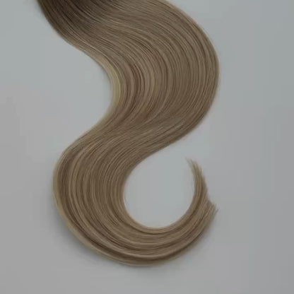 Kayla color Siren Hair Extensions featuring a warm Level 7 base with piano-keyed dimensional ends, including Level 9 sunny golden blonde lowlights and Level 10 sunny golden blonde highlights. Perfect for creating a lived-in sunny blonde look.