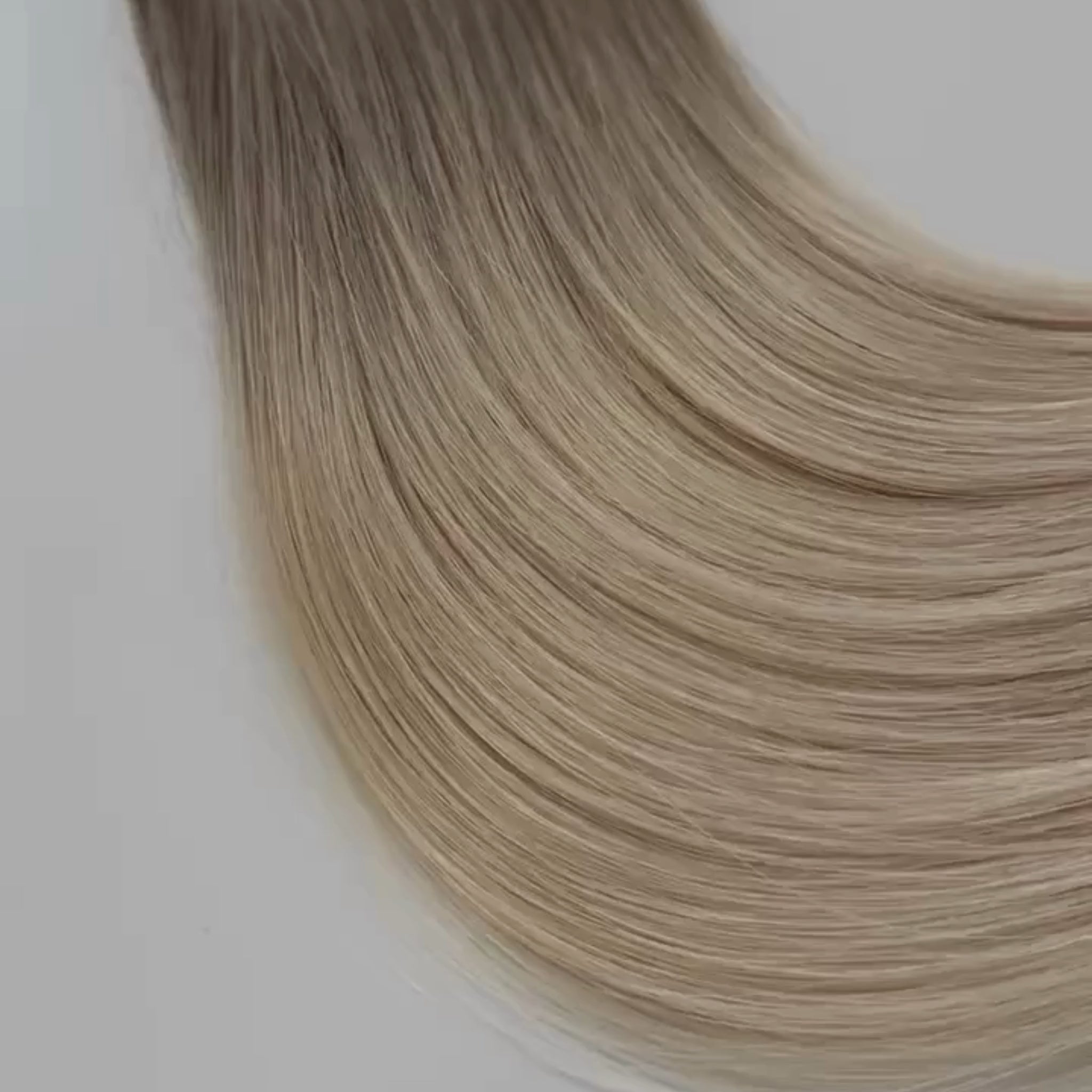 Misty color Siren Hair Extensions featuring a neutral/cool Level 9 base with solid neutral Level 10 ends, offering a sleek, dimension-free look. Ideal for achieving platinum blonde or Barbie-hair perfection.